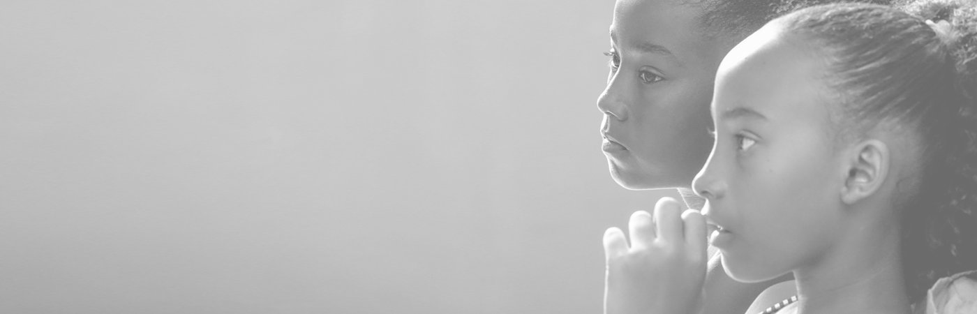 A profile portrait of two young girls.